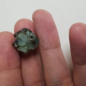 14.65ct green emerald with black inclusions rough crystal gemstone